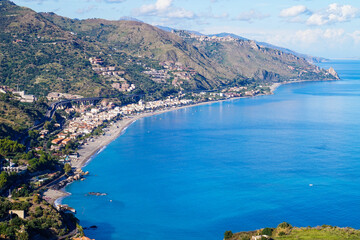 Fototapeta na wymiar Looking ovoer Spisone from the top of Taormina in Sicily on a sunny day