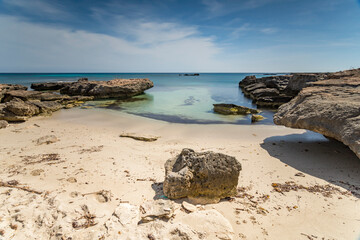 A small sandy beach in Calamoni bay, Favignana island IT - 684586847