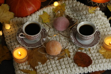 Colorful japanese sweets daifuku or mochi sliced. Sweets close up on the plate with cup of coffee