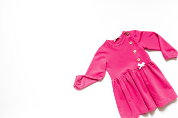Kids wear flat lay - pink girls dress. Baby fashion concept