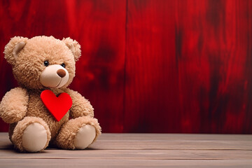 Obraz premium Cute teddy bear with red heart on old wood, copy space, red background. Valentine Concept