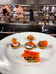 Close up view of a first course dish in a restaurant kitchen - 684600491