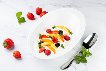 fruit salad with wild berries and strawberries side view