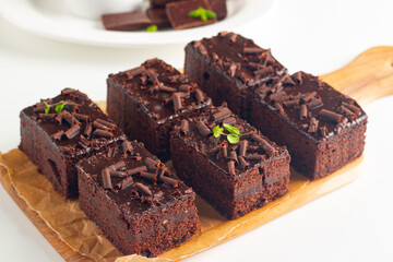 Delicious chocolate brownies with mint on white background. Sweet cake concept. 