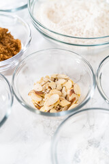 Lemon poppy seed muffins garnished with almond slivers