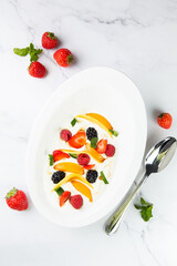 fruit salad with wild berries and strawberries top view