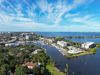 Fototapeta premium Aerial view of the entrance to Crane Creek from the Indian River which leads to the yacht harbor in historic downtown Melbourne along Florida's Space Coast in Brevard County