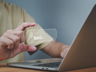 Man with hand showing digital search bar
