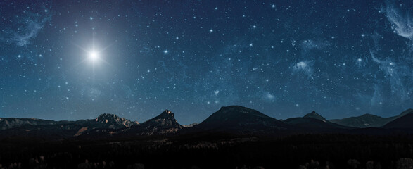  Christmas star shines at night over the mountains of Bethlehem