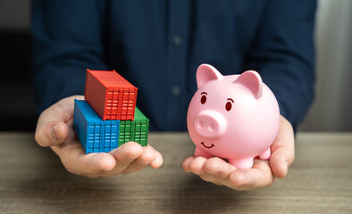 Shipping containers and piggy bank in hands. Potential for financial savings in trade. Logistics...