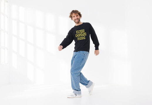 Mockup of man wearing customizable sweatshirt dancing in studio