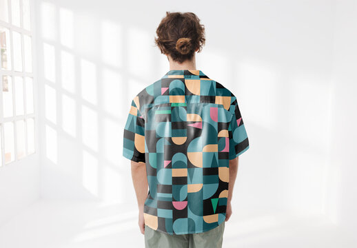 Mockup of man wearing customizable patterned shirt showing back