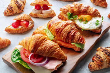 Croissant sandwich variety. Various stuffed croissants. Many rolls filled with ham, salmon, egg, etc