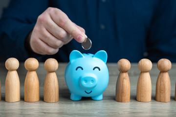 A man puts a coin in a piggy bank among people. Political purses wallets and concealment of...