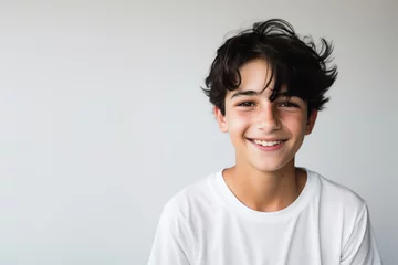 Foto op Plexiglas Portrait of a good looking teenager, boy, smiling, white and neutral teeshirt and background, joy © Olivier