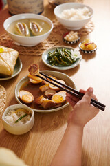 Person Eating Braised Pork
