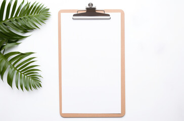 a clipboard with paper and accessories on top a white surface