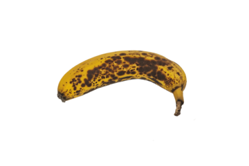 A yellow banana is dotted with black spots. Such a banana is not edible.