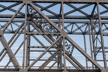 Yaroslavl, Russia, July 8, 2023. Structures of a railway bridge against the sky.