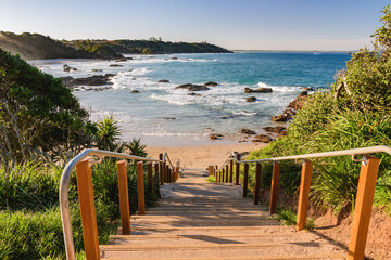 Descend from the parking lot to Nobbys Beach, stairs with handrails lead to the sea, seaside...
