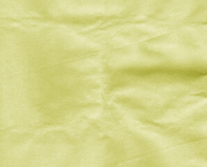 Obraz na płótnie Canvas Crumpled yellow craft paper sheet