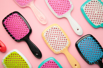 Set of hairbrushes on pink background. Flat lay - obrazy, fototapety, plakaty