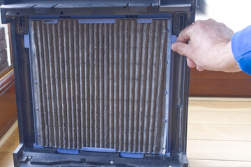 Close up, clean and dirty cabin air filter for home air purification, replaced a new filter into the air purifier machine. Dirty air filter need to maintenance. Preventing allergies. PM 2.5.