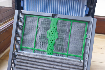 Close up, dirty cabin air filter for home air purification, replaced a new filter into the air purifier machine. Dirty air filter need to maintenance. Preventing allergies. PM 2.5.