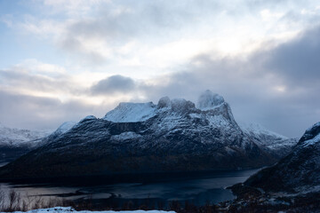 Snowy mountain hike up Segla in Senja, Norway.  Snowcapped mountains in the Arctic Circle of...
