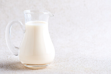 Fresh Milk in a Pitcher on a White Backgrounds.