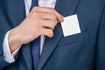 businessman with credit card closeup. Business deal with emoney. Success of business. businessman in suit hold credit card in pocket. Business branding. entrepreneur taking calling card