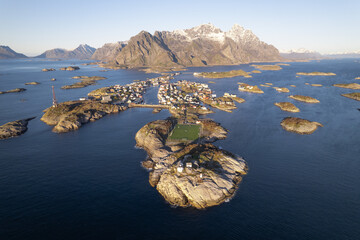 Aerial of Henningsvaer fishing village with soccer field on island.  Located in the Arctic circle...