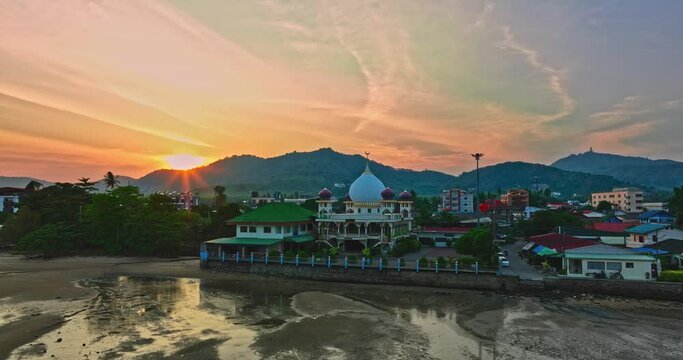 .aerial view scenery stuning sky in sunset above the the mosque..Scene of Colorful romantic sky sunset with Changing the color of the sky background. .beautiful sky at sunset above the mosque