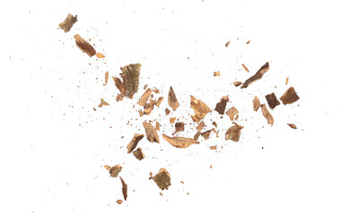 Wood pieces and dust, crushed tree bark isolated on white background, organic texture, top view