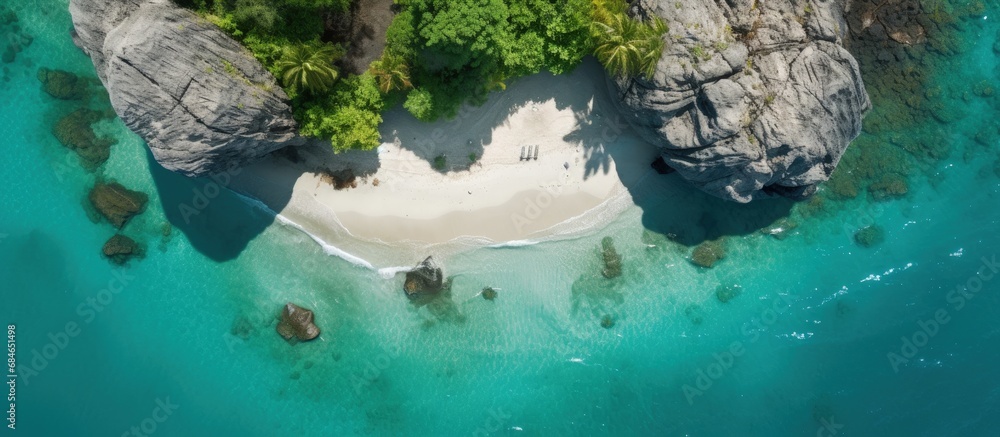Poster aerial drone photo of small island with limestone and emerald sea copy space image