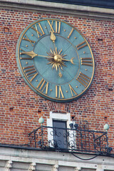 Town Hall Tower's clock close-up on Krakow main square.