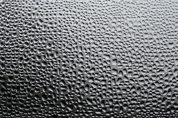 black and white Background of water drops on glass