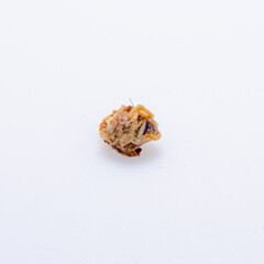 human ear wax on white background