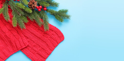Happy New Year, blue background with fir branch and decoration, New Year holiday card, banner, top view, blank space. Copy space. Christmas branch and red scarf