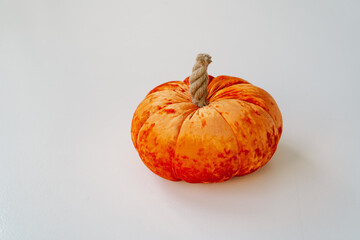 Orange decorative pumpkins are made of fabric. Autumn season