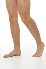 Barefoot male legs on white background. Body care concept.