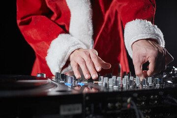 Santa Claus DJ playing music on a New Year's Eve