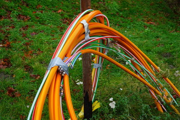 Colorful fiber optic cables for faster Internet in rural regions. Laid in the ground as underground...