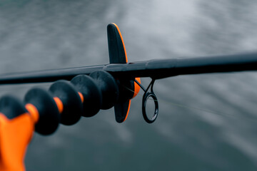 close-up spinning on the background of dark river water sports fishing hobby active recreation...