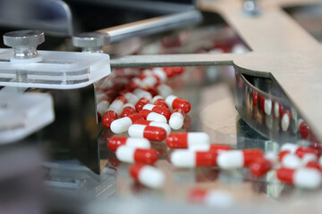 pills tablets on a filling machine