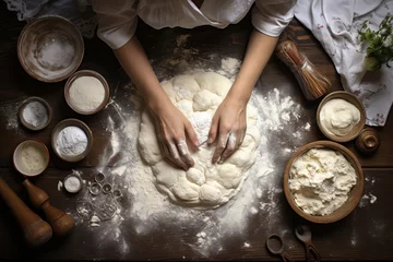 Zelfklevend Fotobehang woman hands preparing dough top down view © arhendrix