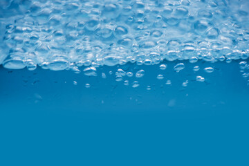 Bluewater bubbles on the surface ripples. Defocus blurred transparent white-black colored clear...