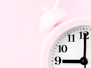 Close Up of Pink Bell alarm clock at 9am and space to add text 