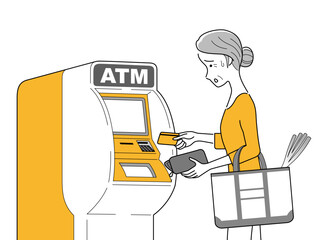 ATMを操作する女性