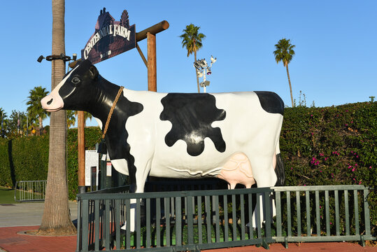 COSTA MESA, CALIFORNIA - 12 NOV 2023: Holstein Cow statue a the entrance to Centennial Farm at the OC Fair and Events Center, Orange County Fairgrounds.